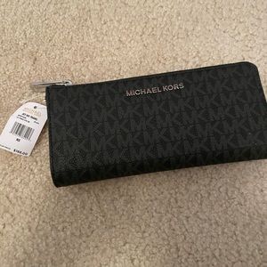 Michael kors never been used. Black with grey